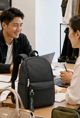 Client and team discuss custom backpack sample